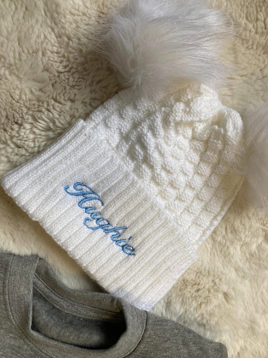 White pom pom hat